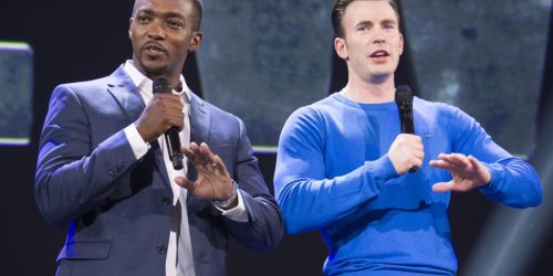 Anthony Mackie and Chris Evans speak at a convention.