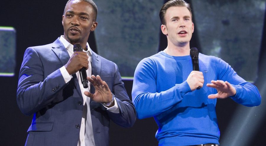 Anthony Mackie and Chris Evans speak at a convention.