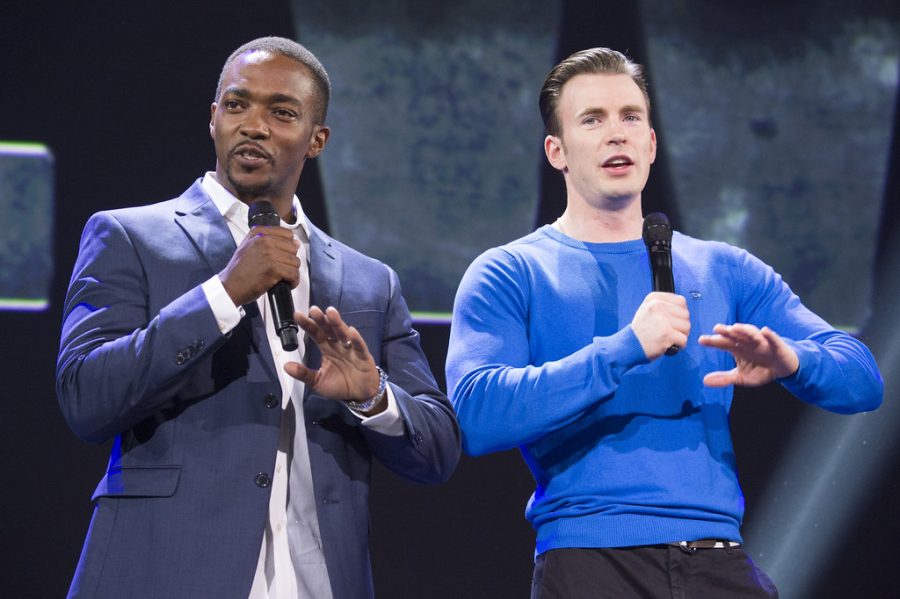 Anthony Mackie and Chris Evans speak at a convention.