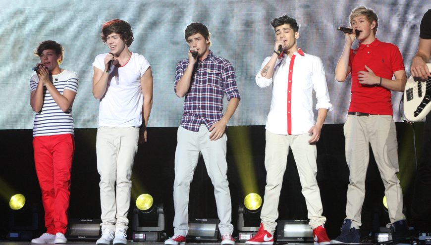 One Direction performs live.
