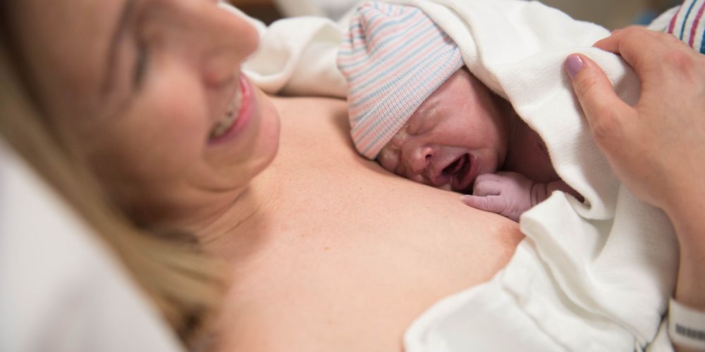 Newborn on its mother's chest