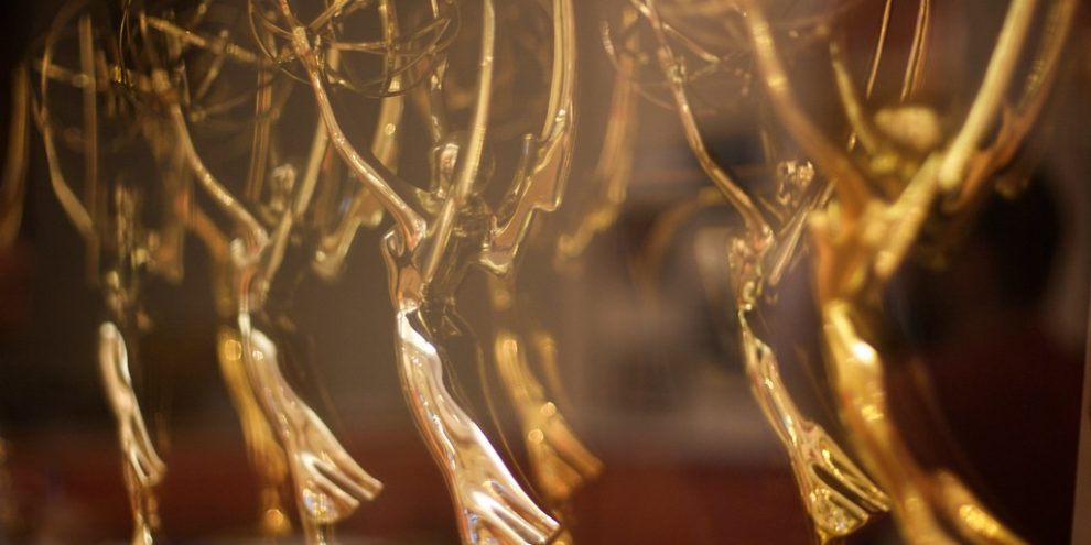 A series of Emmys posed for a photo.