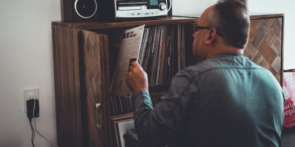 man selecting a record