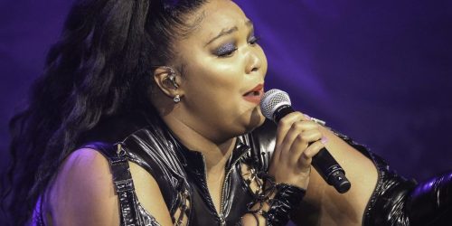 Lizzo sings to a crowd at a show in St. Paul