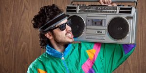 man in 90s style with a boombox