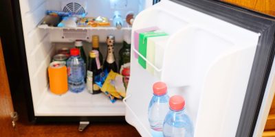 HOTELS ARE NOW CHARGING $50 TO PUT YOUR OWN STUFF IN THE MINI FRIDGE
