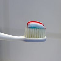 A THIRD OF US BRUSH OUR TEETH WITH HOT WATER